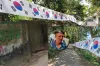 ভক্তের এক অদ্ভুত পাগলামিঃ শ্বশুরবাড়ি পর্যন্ত লম্বা কোরিয়ার পতাকা টানালেন এই ভক্ত